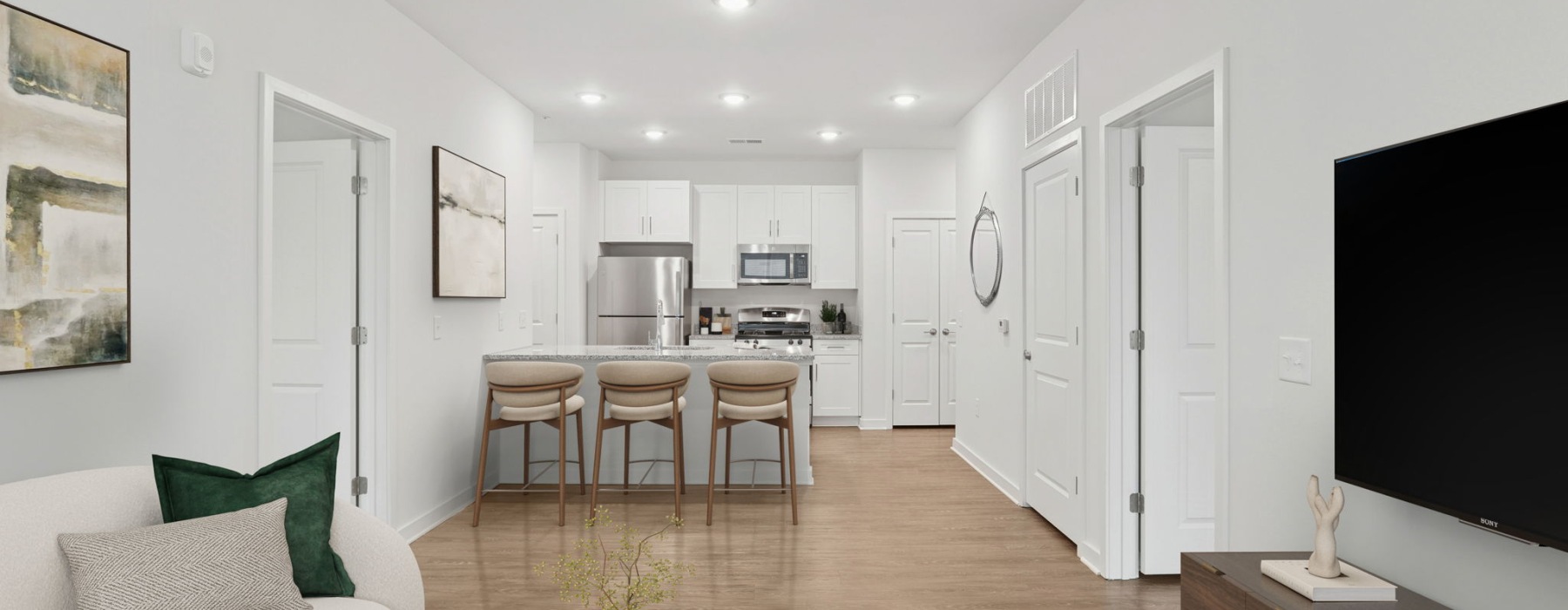 a kitchen with white cabinets