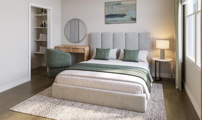 a bedroom with a bed and a desk