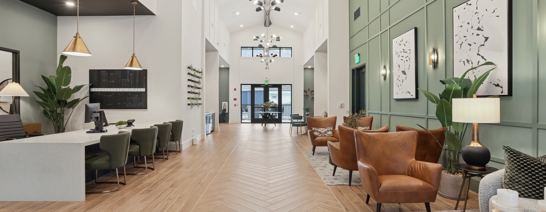 Corridor of leasing office with couches, chairs and tables at Ben Hill Flats apartments near Camp Creek.